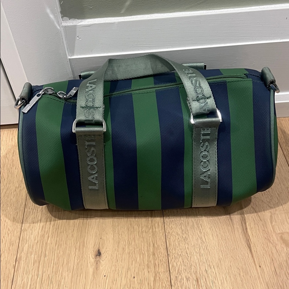 Lacoste Navy and Forest Green Striped Duffel Bag

L8.65 x H11.8 x D8.65"